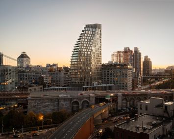 A photo of the Brooklyn skyline with the Olympia Dumbo building.