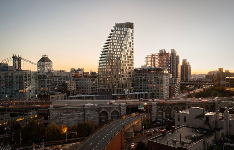A photo of the Brooklyn skyline with the Olympia Dumbo building.