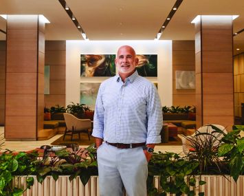 A man standing in a building lobby.