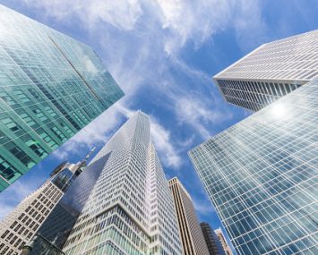 Skyscrapers soaring into a blue sky.