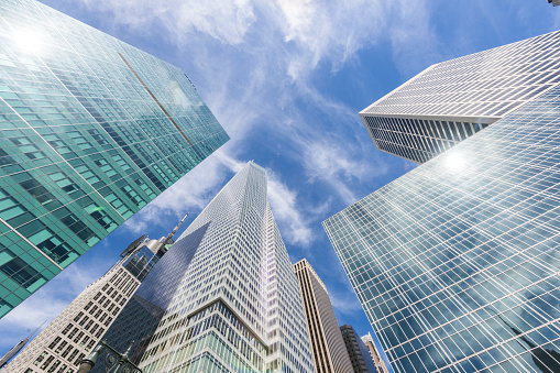 Skyscrapers soaring into a blue sky.