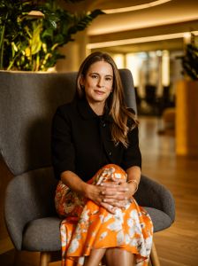 A woman sitting in an office chair. 