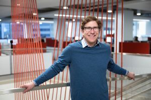 Justin Bedecarre, of JLL, poses for a portrait at their offices.