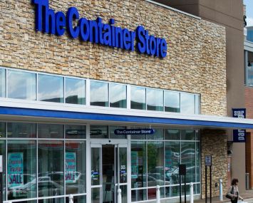 Signs on The Container Store, Party City, and Big Lots stores