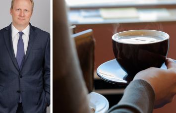 REBNY Vice President of Market Data Keith DeCoster and a customer carries a cup of coffee at a Brooklyn coffee shop.