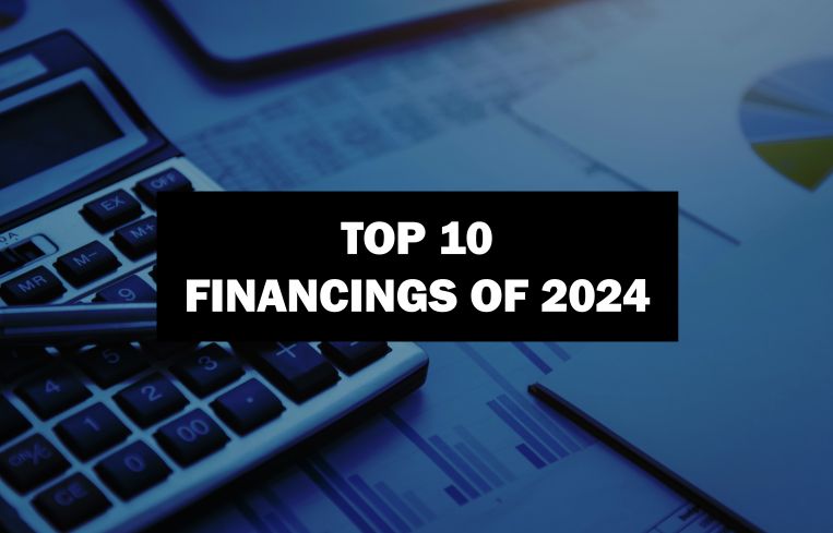 An image of a calculator with the words "Top 10 financings of 2024" in front of it.