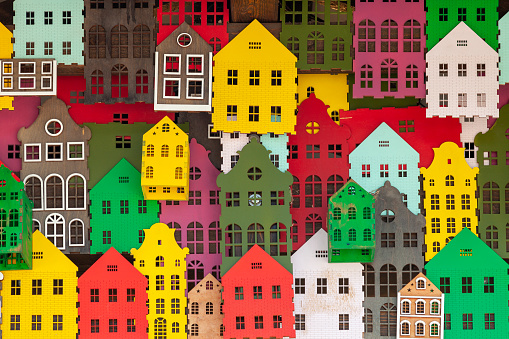 An illustration of colorful houses packed in together.