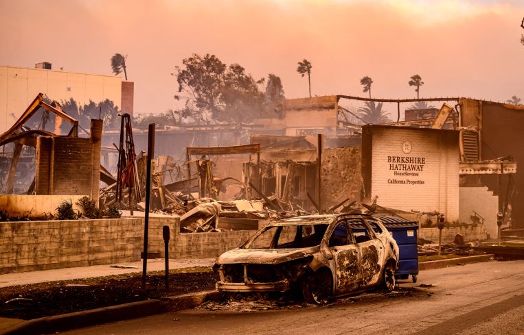 A Berkshire Hathaway office is left in smoldering ashes during the Palisade fire in the Palisade village area Pacific Palisades.