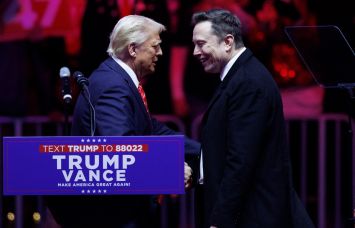Donald Trump shaking hands with Elon Musk.