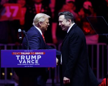 Donald Trump shaking hands with Elon Musk.