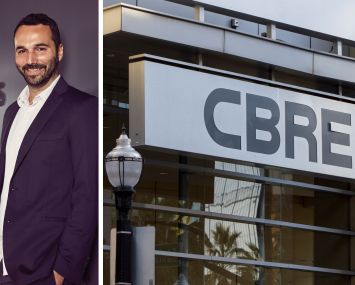 Industrious CEO Jamie Hodari and a CBRE sign.