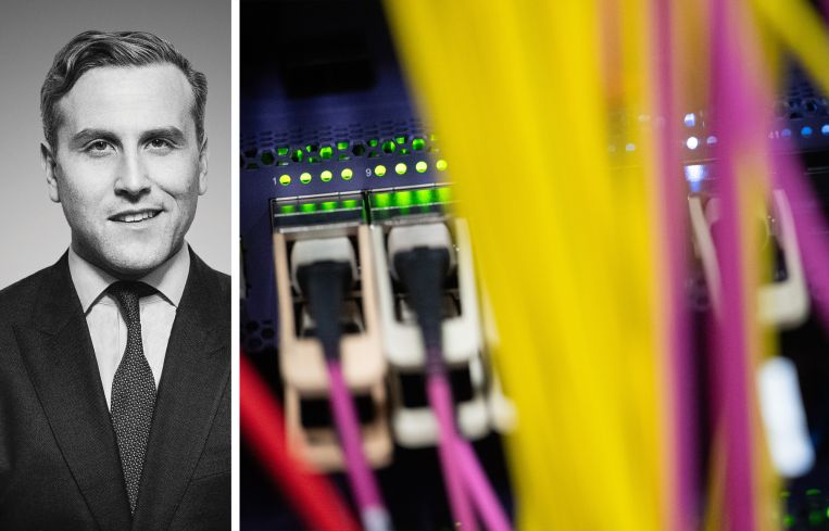 Newmark's Jordan Roeschlaub and networking cables attached to a computer server.