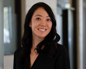 A woman smiling.