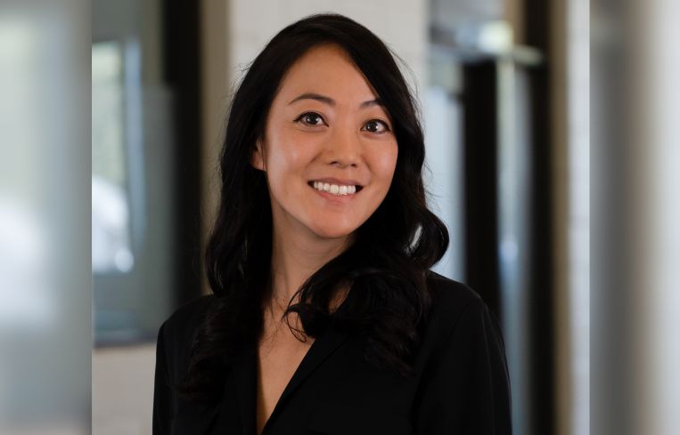 A woman smiling.
