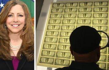 Bureau of Engraving and Printing Director Patty Collins and a printing supervisor inspects sheets of one dollar bills.
