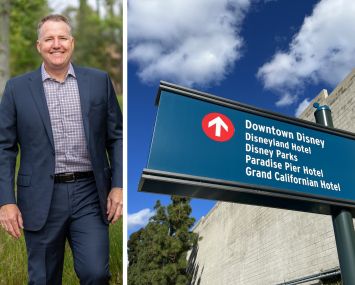 Dynamic City's chief investment officer Ryan Phelps and a sign directing people to hotels near Disneyland.