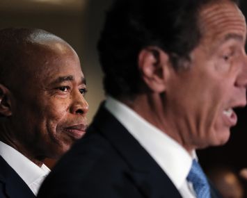 A photo of Eric Adams and Gov. Cuomo.