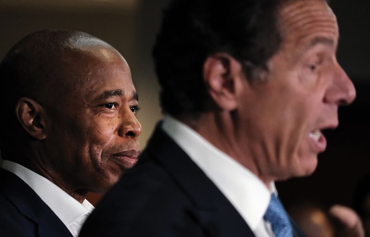 A photo of Eric Adams and Gov. Cuomo.