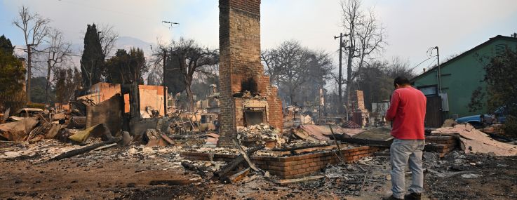 Residents inspect the area among the rubbles of their burnt houses during Eaton wildfire in Altadena of Los Angeles County, California.