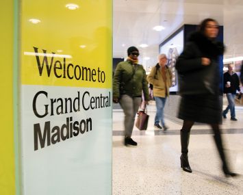 Commuters walk through Grand Central Madison.