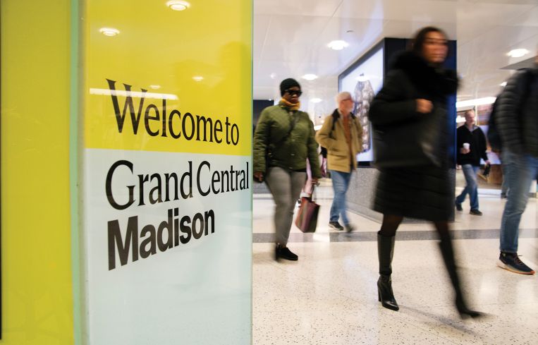 Commuters walk through Grand Central Madison.