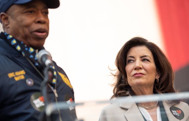 Gov. Kathy Hochul looks at Mayor Eric Adams speak at the campaign launch event for 'We Love NYC' in 2023.
