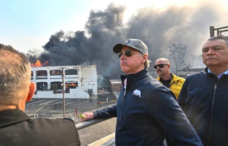 California Gov. Gavin Newsom surveys damage in Pacific Palisades with CalFire's Nick Schuler and state Sen. Alex Padilla..