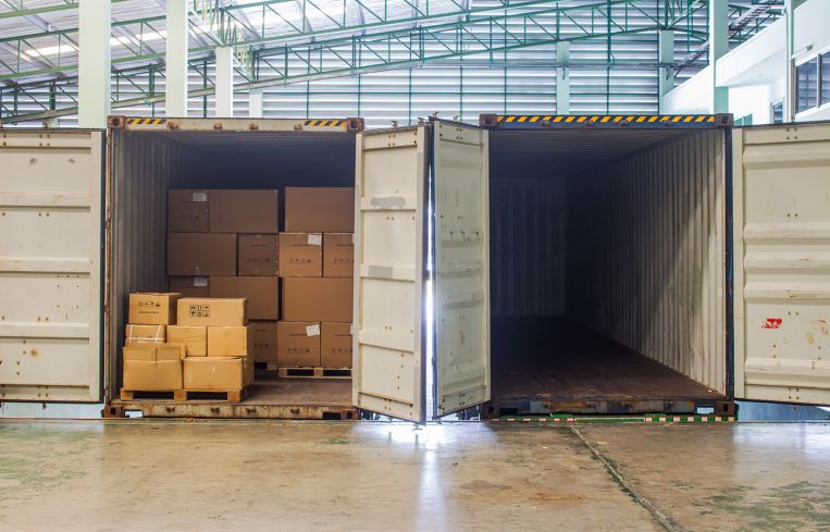 Shipping containers in a warehouse.