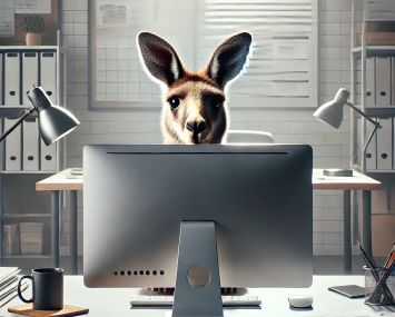 An illustration of a kangaroo looking over a computer monitor.