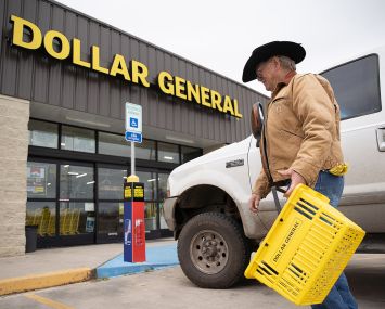A customer walking into a Dollar Store.