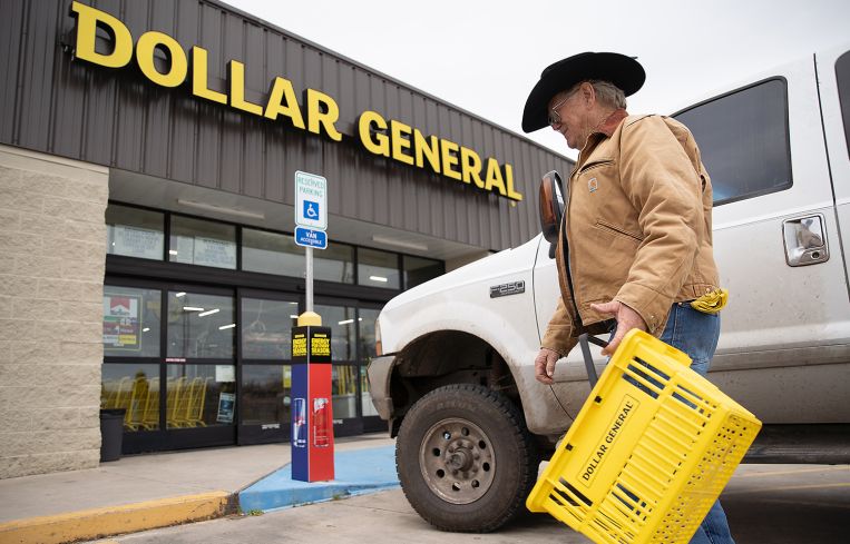 A customer walking into a Dollar Store.
