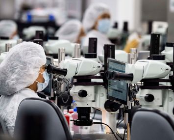 Employees work in a lab at Edwards Lifesciences in Irvine, Calif.