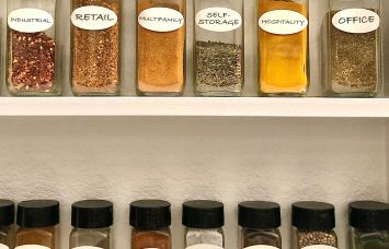 A spice rack with different commercial real estate asset classes written on the labels.