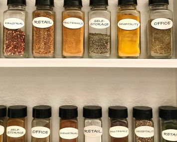 A spice rack with different commercial real estate asset classes written on the labels.