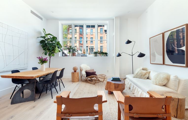 Amenities within the units include hardwood floors, Carrara marble countertops, in-unit washers and dryers, garbage disposals, and fixtures by Waterworks.