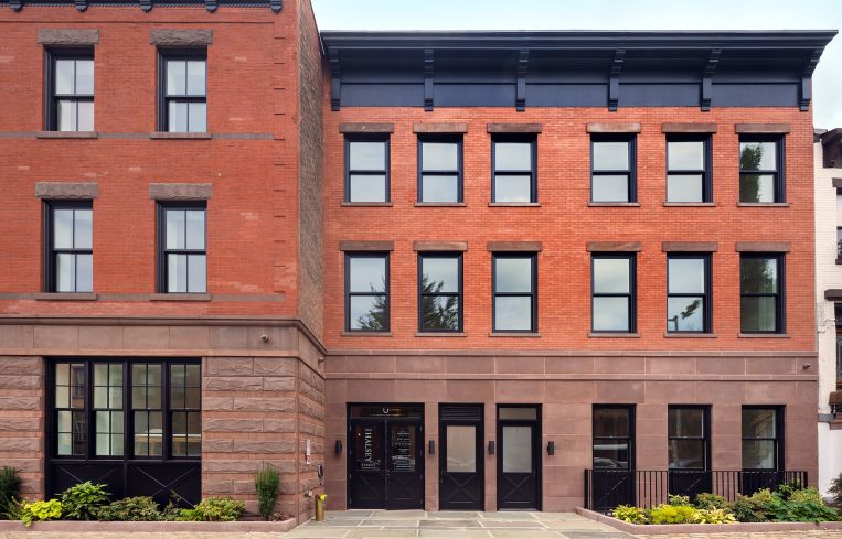 The exterior of 524 Halsey Street pays homage to the building's past as a horse stable.