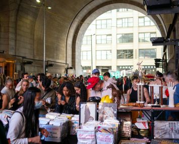 People shop at Brooklyn Flea under the Manhattan Bridge in Brooklyn.