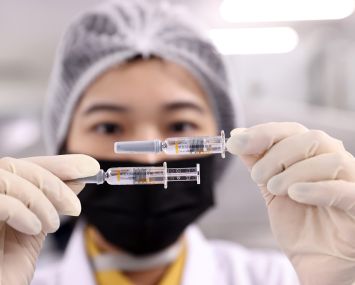 An employee works on the production line of COVID-19 vaccine in Beijing, China.