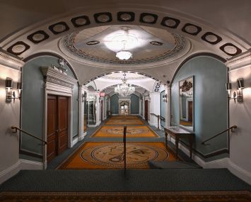 An empty hallway in a hotel.