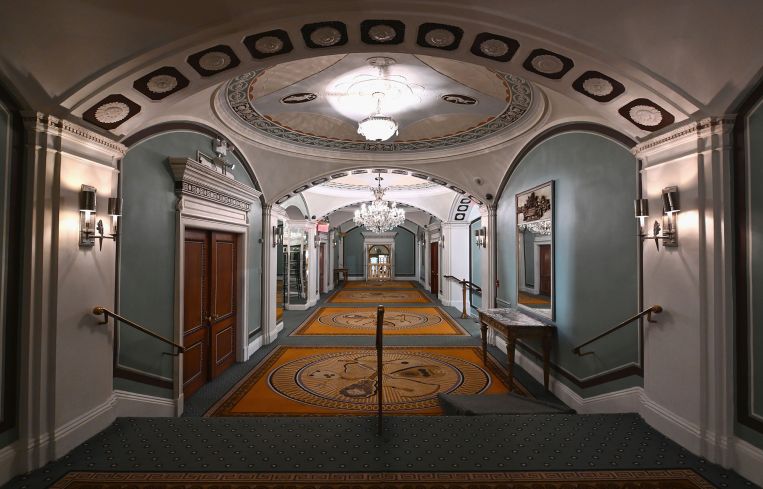 An empty hallway in a hotel.