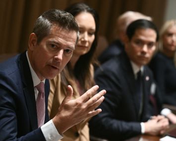 Secretary of Transportation Sean Duffy (L) speaks at a cabinet meeting.