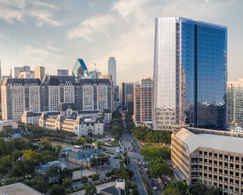 Aerial rendering of a shiny office tower.