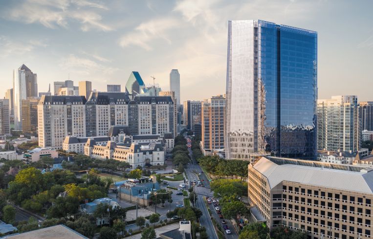 Aerial rendering of a shiny office tower.