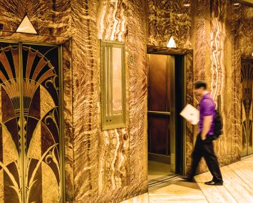 A person walking into an elevator.