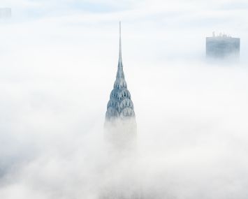 The Chrysler Building protrudes above the clouds in Manhattan.