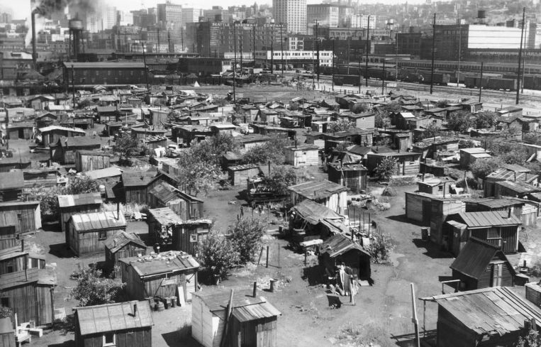 A aerial shot of a bunch of shoddy tents.
