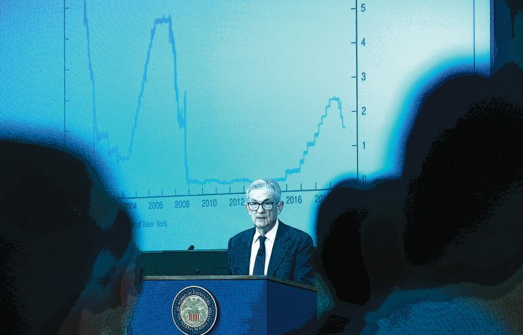 A man at a podium in front of a graph.