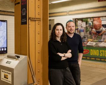 Artists Sarah Cassidy (left) and Akiva Leffert have installed a dinosaur-themed bodega in a closed newsstand at Grand Army Plaza subway station in Brooklyn.