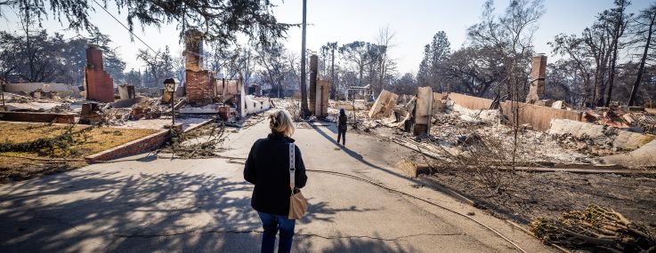 Los Angeles County Supervisor Kathryn Barger surveys the Eaton fire damage in January.