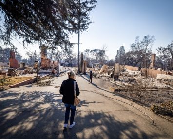 Los Angeles County Supervisor Kathryn Barger surveys the Eaton fire damage in January.